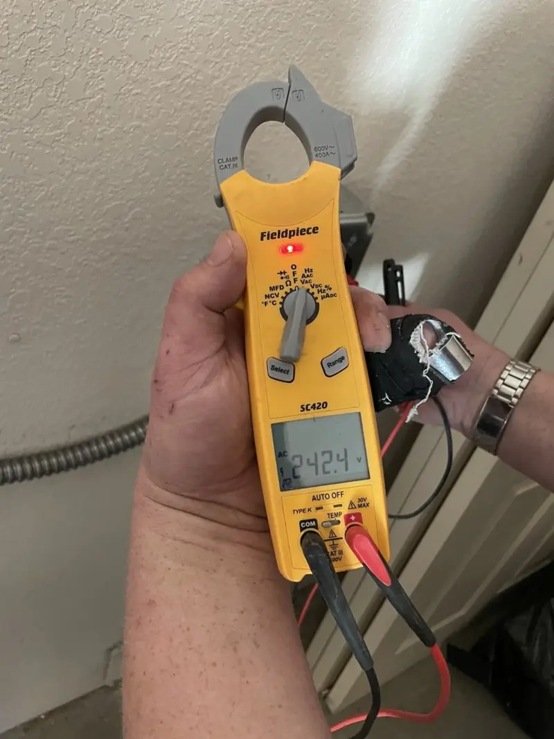 Voltage testing with clamp meter during Generator Installation in Green Lake